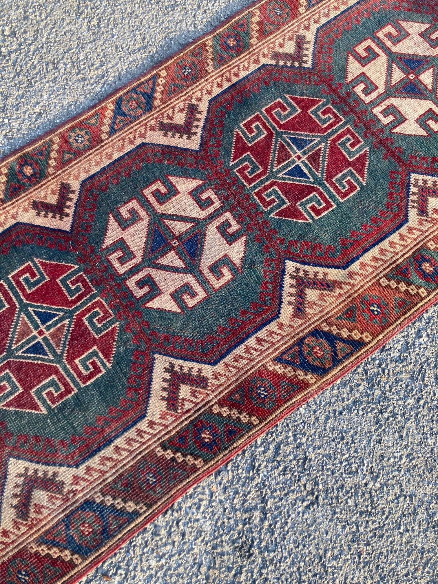 A Caucasian design green ground runner, 340 x 76cm